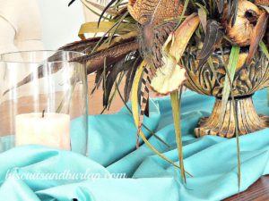 Centerpiece with Peacock feathers and satin