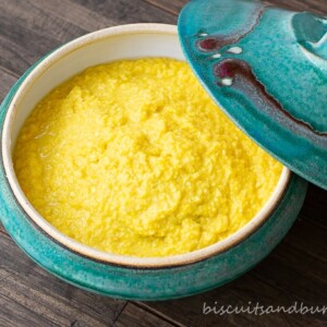 creamed corn in blue pottery bowl with lid