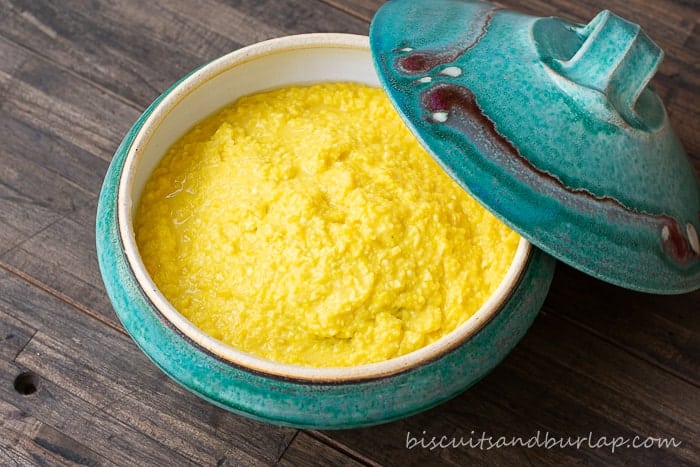 creamed corn in blue pottery bowl with lid