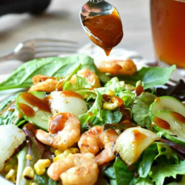 bbq shrimp salad with dressing.