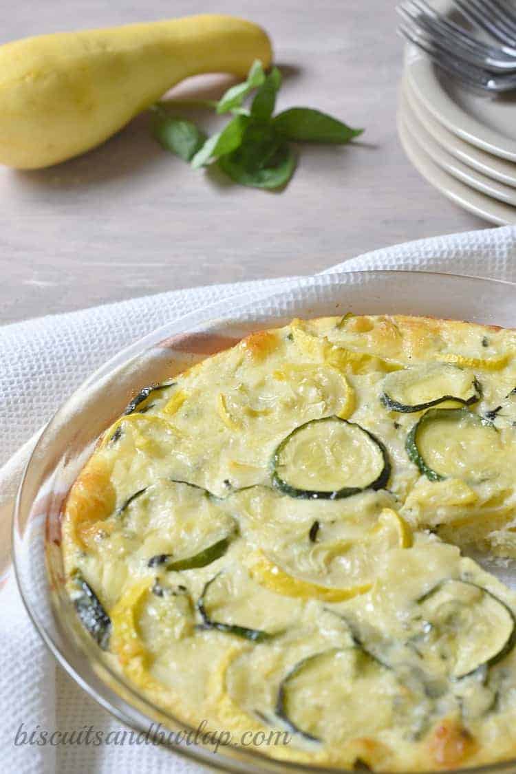 close up of squash pie in a clear glass baking dish