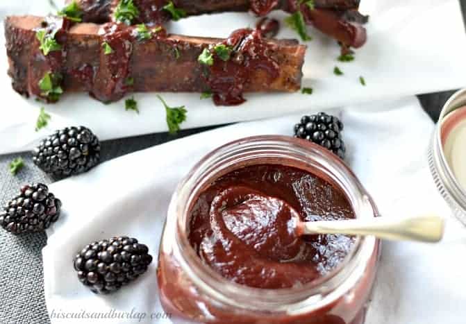 ribs behind jar of barbecue sauce. 