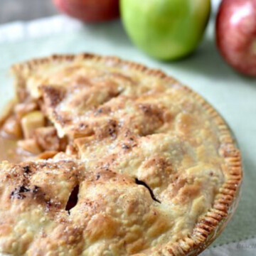 apple pie with slice out.