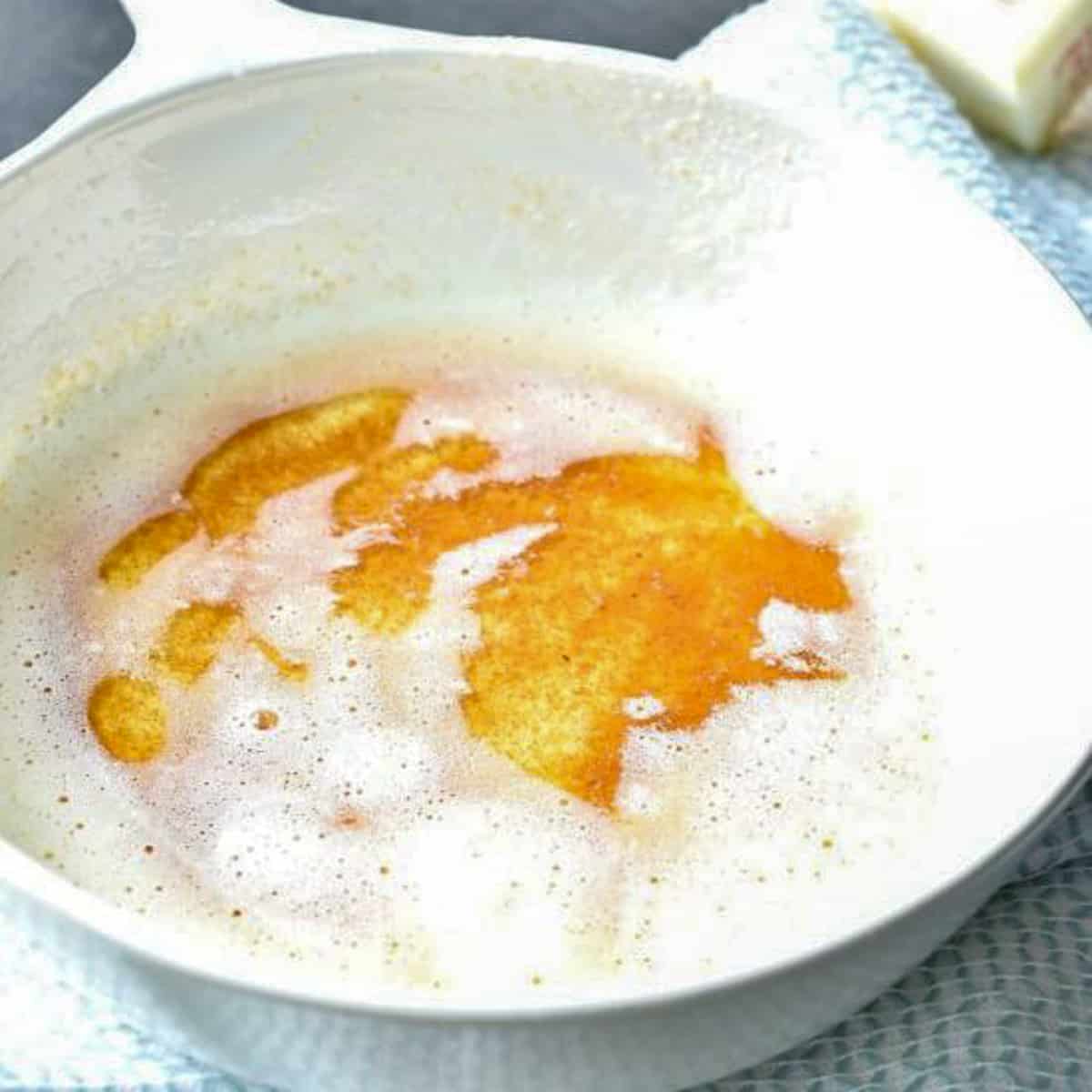 brown butter in white dish.