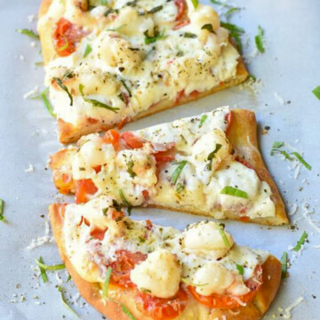 lobster flatbread cut into pieces.