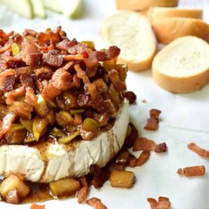 baked brie with apples and bacon on top.