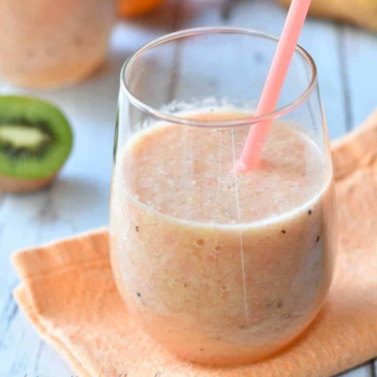 smoothie in glass with straw.