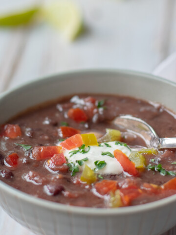 black bean and ham soup with garnishes on top