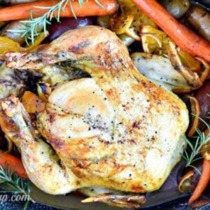 chicken surrounded by fruits and vegetables.