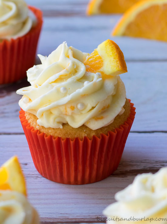 Orange cupcakes with cream cheese orange frosting from BiscuitsandBurlap.com