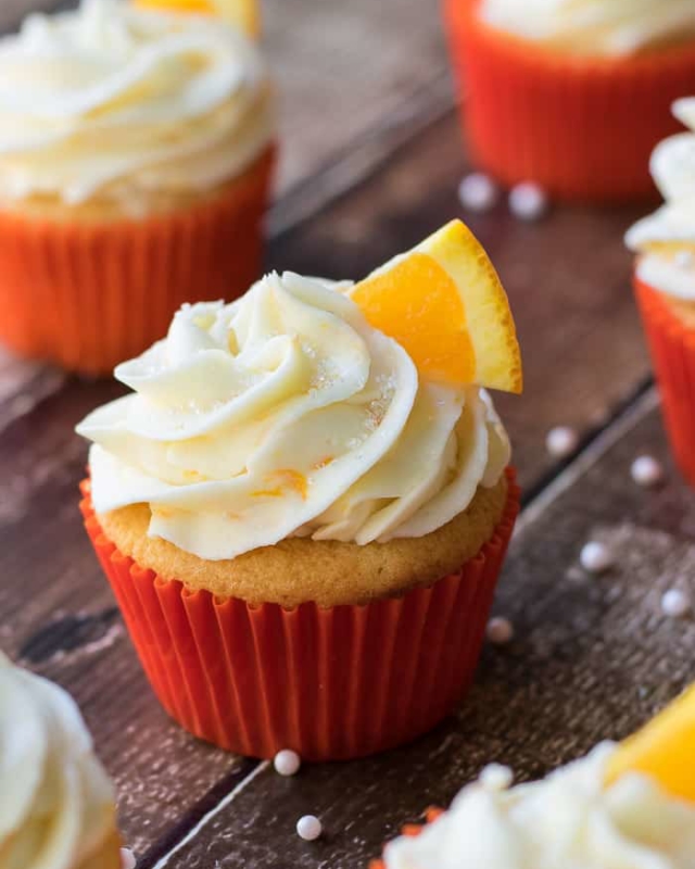 Orange cupcakes with cream cheese orange frosting from BiscuitsandBurlap.com