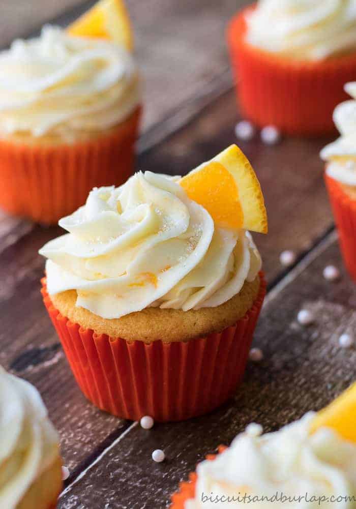 Orange cupcakes with cream cheese orange frosting from BiscuitsandBurlap.com