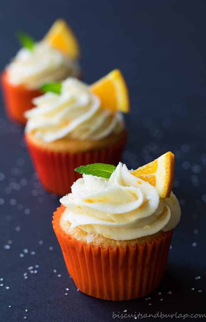 Orange cupcakes with cream cheese orange frosting from BiscuitsandBurlap.com