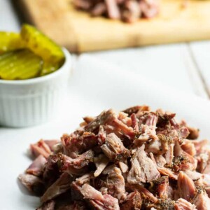 barbecue pork on a charcoal grill from BiscuitsandBurlap.com