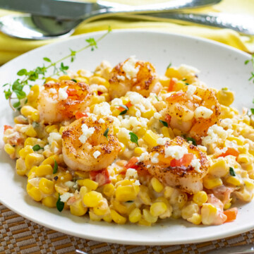 corn and shrimp dish on plate.