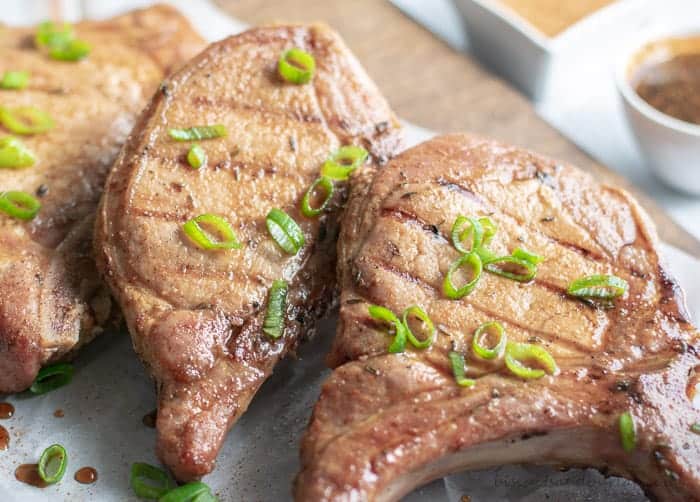 Grilled pork chops with cajun seasoning stay tender with brining