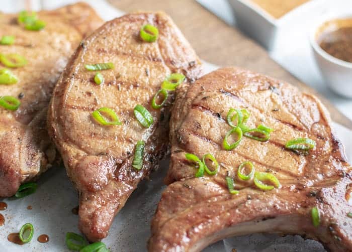 Grilled pork chops with cajun seasoning stay tender with brining