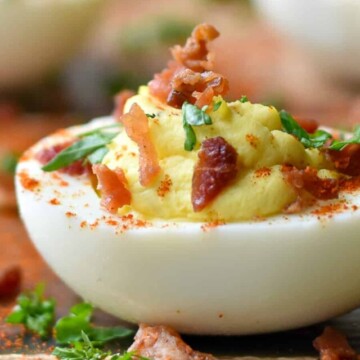 bacon jalapeno deviled egg on board.