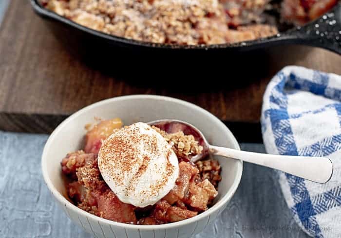 Apple Crisp with Cranberries is the perfect fall dessert baked in an iron skillet.