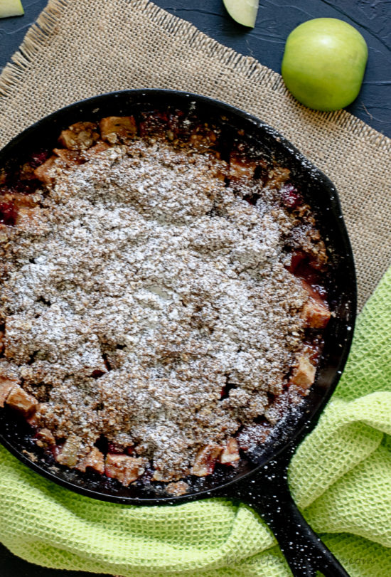 Apple Crisp with Cranberries is the perfect fall dessert baked in an iron skillet.