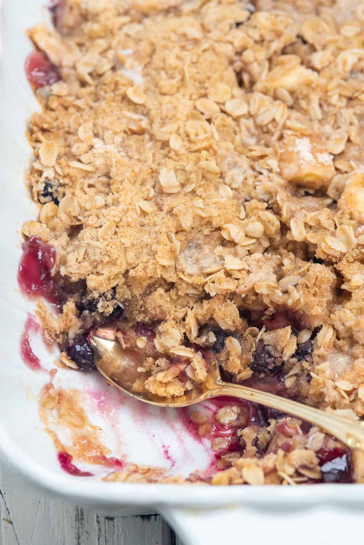 apple blueberry crisp with a spoon