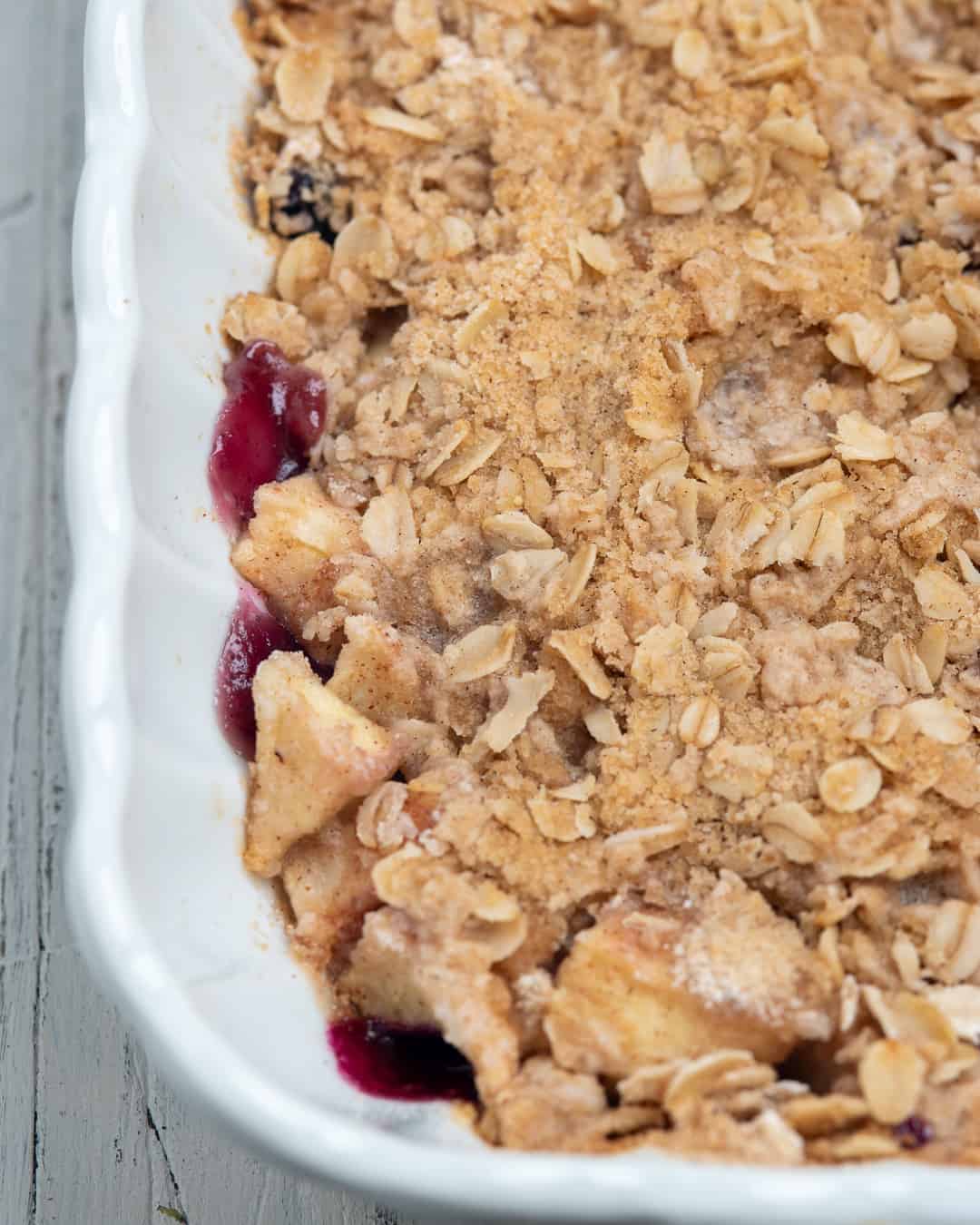 apple crumble in a white baking dish