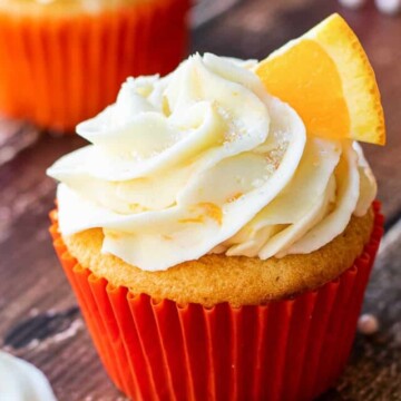 orange cupcakes on board.