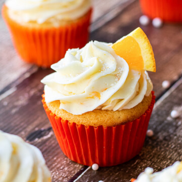 orange cupcakes on board.