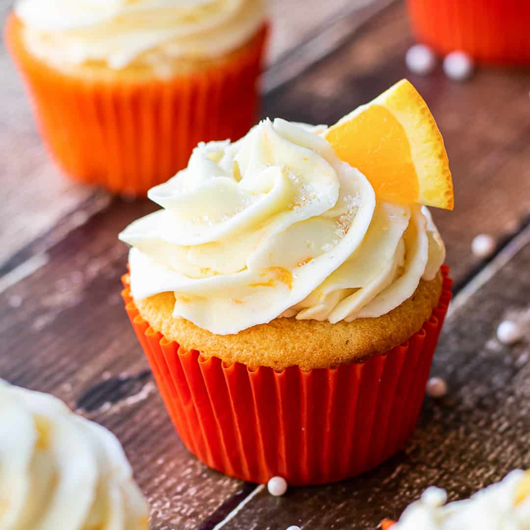 orange cupcakes on board.