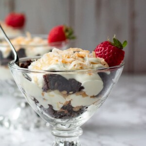 mini chocolate trifles layers of brownie crumbles, creamy cheesecake and toasted coconut