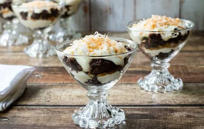 mini chocolate trifles layers of brownie crumbles, creamy cheesecake and toasted coconut