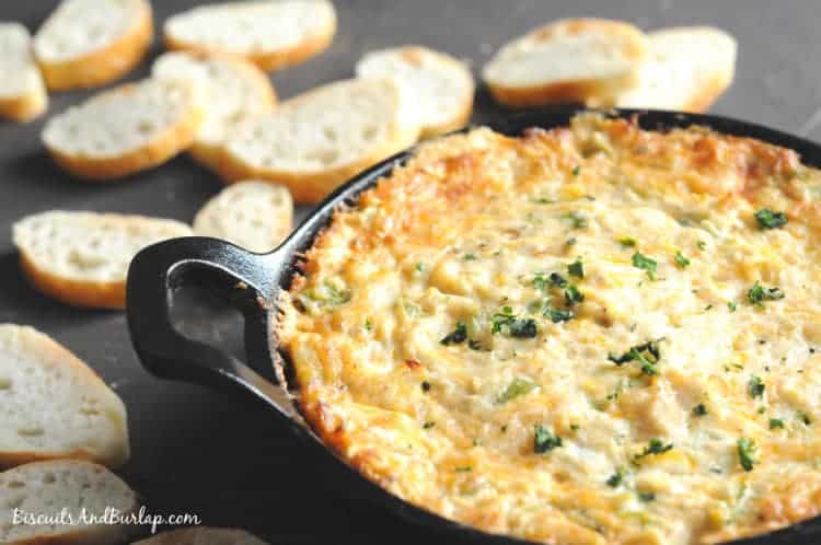 Cajun Crab Dip in a cast iron skillet on a dark background