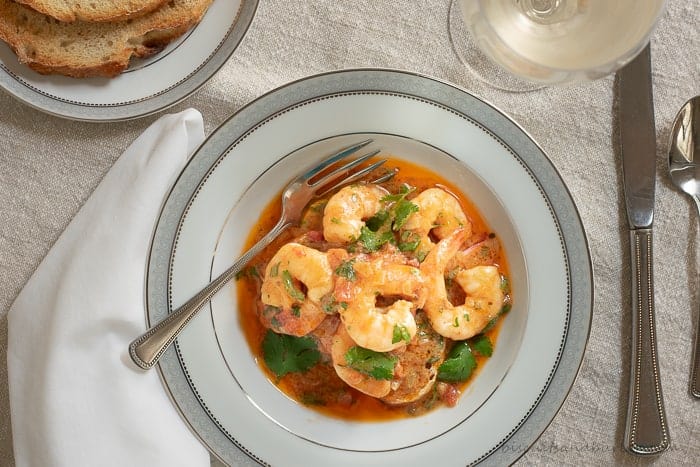 Shrimp in a buttery sofrito sauce is simple to make. Served over a thick slice of toasted sourdough bread you'll want extra bread to get every last drop of the mouthwatering sauce.
