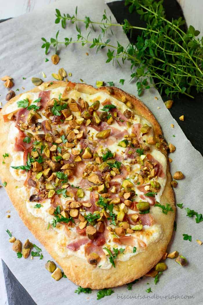 Flatbread appetizers with a unique blend of flavors from pistachios, burrato and proscuitto