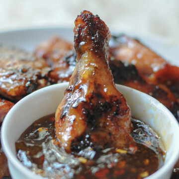 chicken wing dipped in sauce.