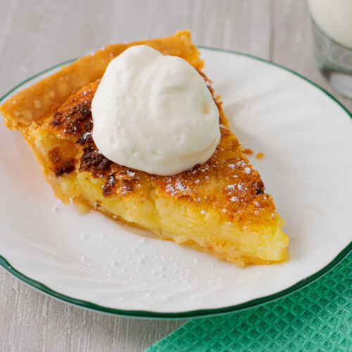 slice of buttermilk pie with whipped cream.