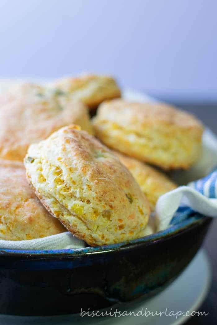 vertical shot of biscuits in pottery bowl