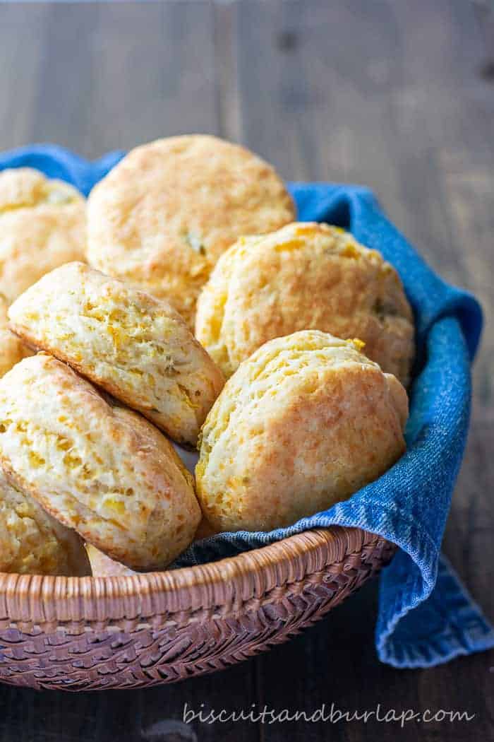 Biscuits similar to mexican cornbread in basket with denim napkin