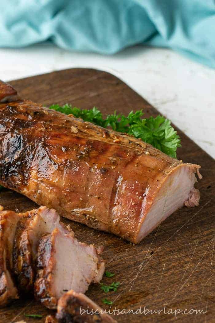 pork tenderloin is marinated and then grilled to perfection and served on board
