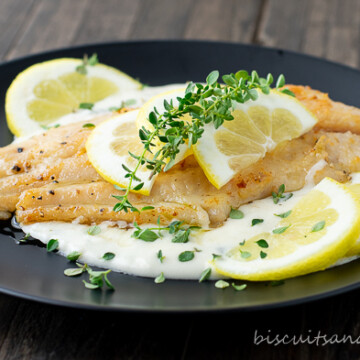 catfish on black plate with sauce