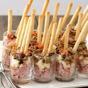 muffaletta appetizers in small glasses.