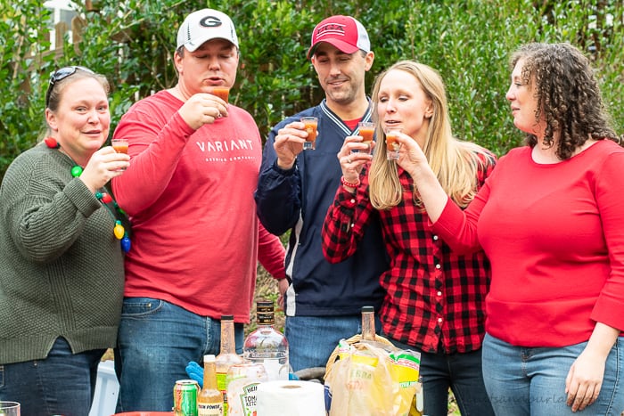 people toasting with oyster shooters