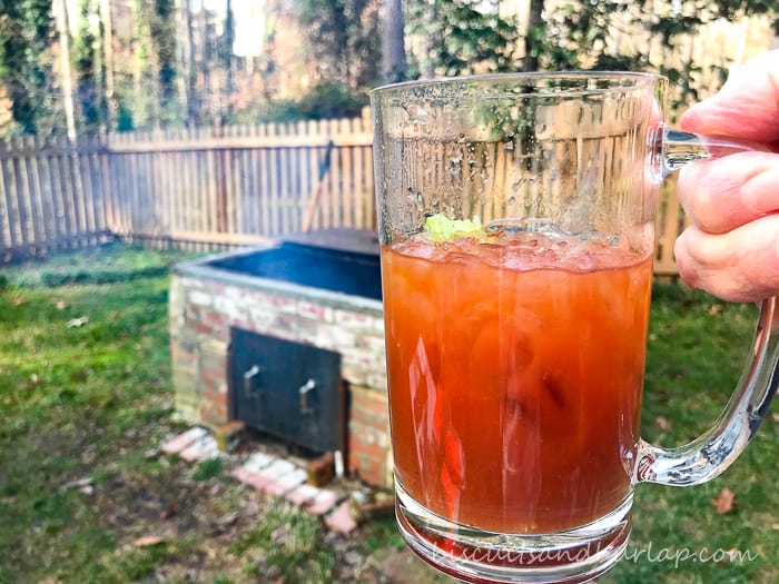 bloody mary with bbq pit in background