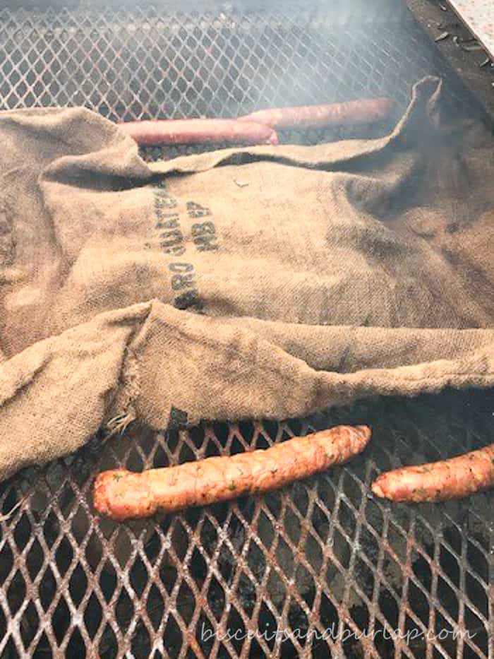 oysters on grill covered with burlap