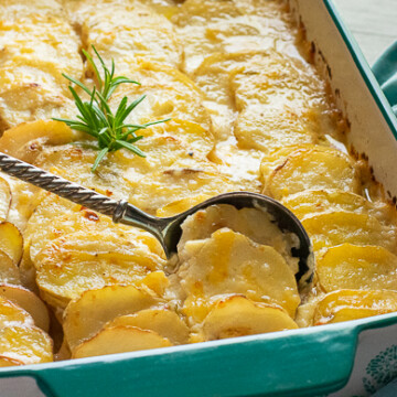 potato gratin with spoon dipping portion