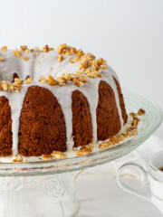 coffee cake on glass stand with coffee.