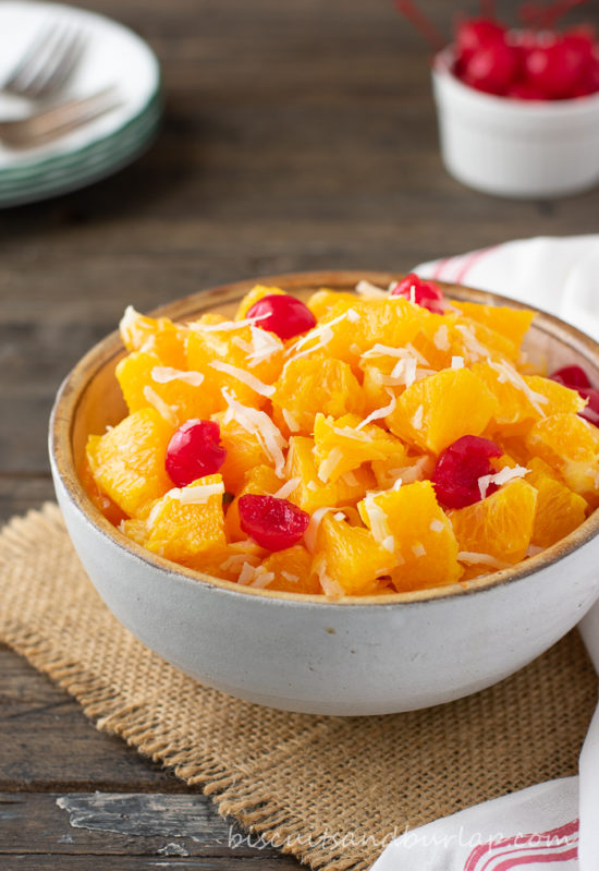 ambrosia in bowl with cherries behind