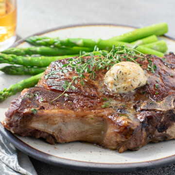 scoop of Cajun steak butter on steak.