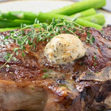 scoop of Cajun steak butter on steak.