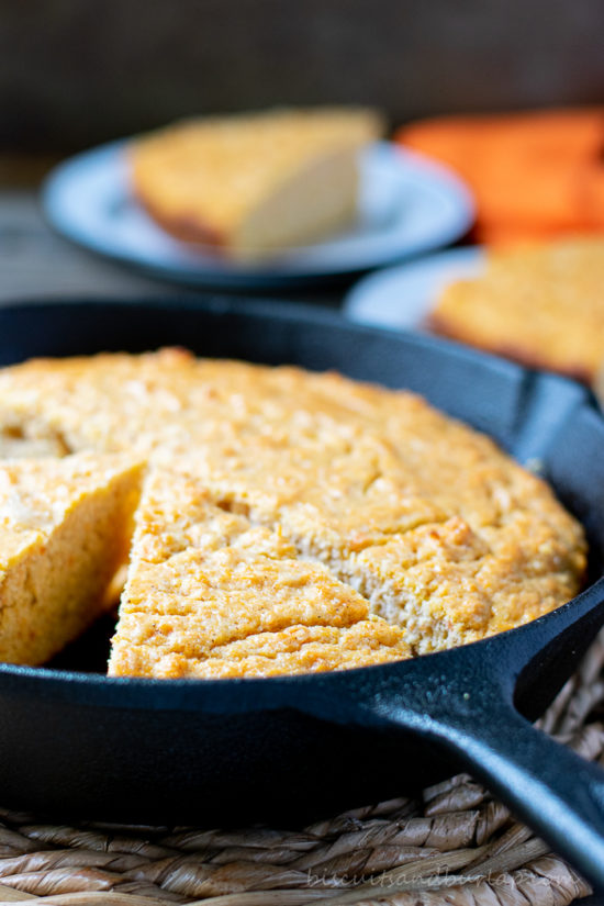 vertical shot of sweet potato cornbread in skillet